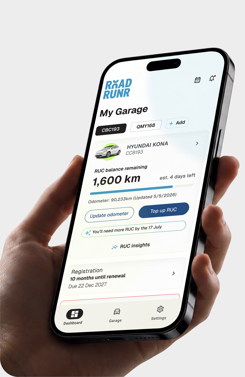 Hand holding phone showing RoadRUNR app